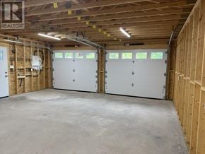 Heyden apartment for rent - A garage with two doors and a window is under construction.
