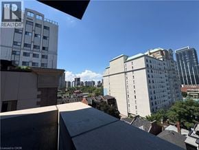 Hamilton apartment for rent - A cityscape with buildings and a clear sky.