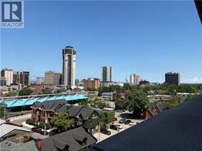 Hamilton apartment for rent - A cityscape with a clear blue sky and buildings of various heights.