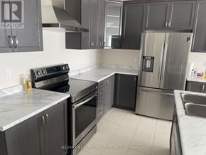 Orillia apartment for rent - A kitchen with a stove, oven, and refrigerator.