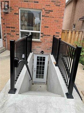 Brampton (Sandringham-Wellington) apartment for rent - A black metal railing on a concrete staircase.