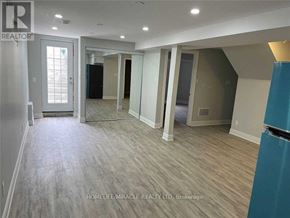 Brampton (Sandringham-Wellington) apartment for rent - A realtor photo of a room with wood flooring and white walls.