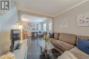 St. Catharines (Facer) apartment for rent - A living room with a couch, a coffee table, and a television.