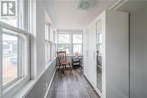 St. Catharines (Facer) apartment for rent - A room with a chair and a table in front of a window.