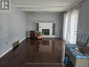 Hamilton (Gilkson) apartment for rent - A living room with a fireplace and a couch.