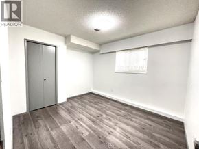 Vancouver apartment for rent - A room with a grey door and a grey floor.