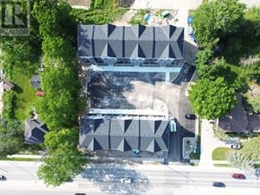 London North (North C) townhouse for rent - A large building with a geometric design is surrounded by trees.