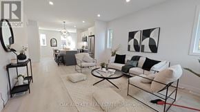 London North (North C) townhouse for rent - A living room with a white couch and a coffee table.