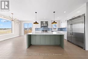 Ottawa apartment for rent - A modern kitchen with a large island and stainless steel appliances.