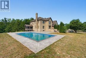 Caledon apartment for rent - A large house with a pool in the backyard.