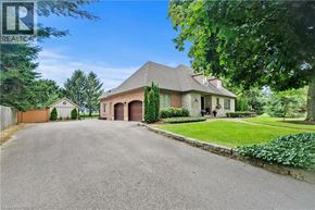 Niagara-On-The-Lake apartment for rent - A large house with a driveway in front of it.