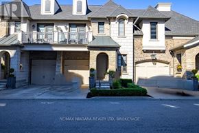 St. Catharines (Glendale/Glenridge) townhouse for rent - A large, luxurious house with a balcony and multiple windows.