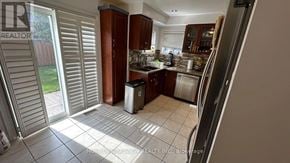 Vaughan (Maple) apartment for rent - A kitchen with a refrigerator, sink, and cabinets.