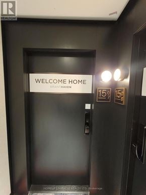 Oakville (Oa Rural Oakville) condo for rent - A black door with a sign that says "Welcome Home Branthaven" on it.