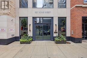 Toronto (Waterfront Communities) condo for rent - The front of a building with the sign "327 King West" and a RE/MAX Escarpment Realty Inc. logo.