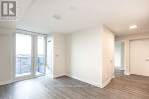 Toronto (Clanton Park) condo for rent - A spacious room with a sliding glass door leading to a balcony.