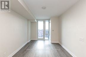 Toronto (Clanton Park) condo for rent - A spacious room with a sliding glass door leading to a balcony.