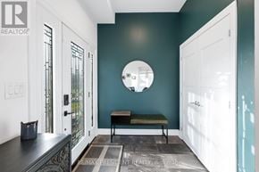Toronto (Clairlea-Birchmount) apartment for rent - A hallway with a bench and a mirror on the wall.