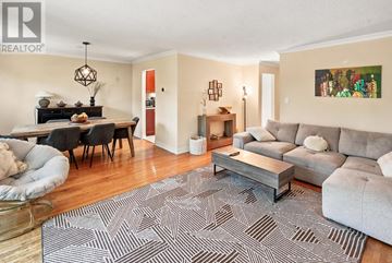 Mississauga (Cooksville) apartment for rent - A living room with a grey rug and a grey couch.