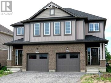 Niagara Falls (Lyons Creek) apartment for rent - A two-story house with a garage on the ground floor.