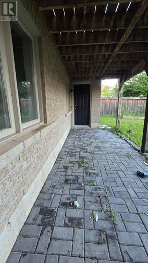 Ajax (Northwest Ajax) apartment for rent - A patio with a black tiled floor and a wooden ceiling.