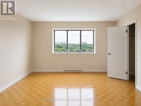 Mississauga (Applewood) condo for rent - A room with a large window and wooden flooring.