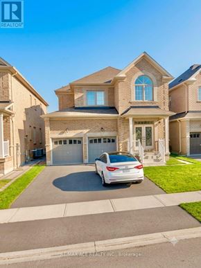 Brampton (Bram East) apartment for rent - A white car is parked in front of a two-story house.