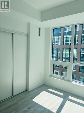 Toronto (Waterfront Communities) condo for rent - A room with a large window and a sliding door.