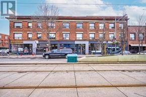 Toronto (Oakwood Village) multi-family for rent - A street view of a building with a car parked in front.