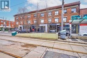 Toronto (Oakwood Village) multi-family for rent - A street view with a building in the background and a sign that says REALTOR.
