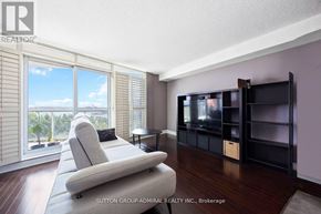 Toronto (Waterfront Communities) condo for rent - A living room with a large couch and a television.