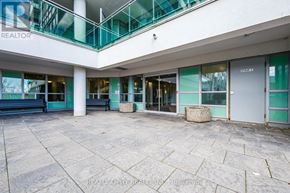 Toronto (Clairlea-Birchmount) condo for rent - A large open space with a glass balcony and a sign that says REALTOR.