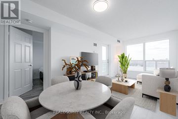 Toronto (Clairlea-Birchmount) condo for rent - A modern living room with a dining table and chairs.