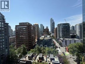 Vancouver apartment for rent - A cityscape with a mix of residential and commercial buildings.