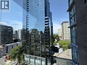 Vancouver apartment for rent - A tall glass building with the logo REALTOR on the top left corner.