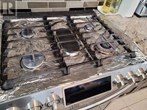 Ajax (Northwest Ajax) apartment for rent - A stove top with four burners and a pot on the second one from the left.