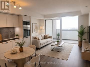 Toronto (Waterfront Communities) condo for rent - A well-lit, modern living room with a dining table and chairs, a sofa, and a kitchen area with a stove and oven.