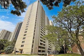 Toronto (Briar Hill-Belgravia) condo for rent - A tall building with a sign that says RE/MAX Elite Real Estate Brokerage.