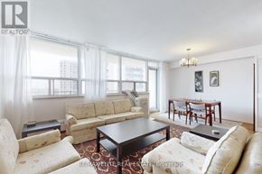 Toronto (Briar Hill-Belgravia) condo for rent - A living room with a couch, chair, and coffee table.