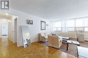 Toronto (Briar Hill-Belgravia) condo for rent - A living room with a couch, chair, and coffee table.