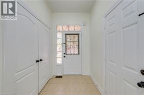 Mississauga apartment for rent - A white door with a glass window in the middle of a hallway.