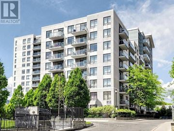 Toronto (Dovercourt-Wallace Emerson-Junction) condo for rent - A large apartment building with the number 812 on the front.