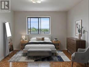 Mississauga (Applewood) condo for rent - A bedroom with a large bed, a nightstand, a dresser, and a chair.