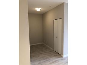 Surrey apartment for rent - A room with a white door and a light on the ceiling.