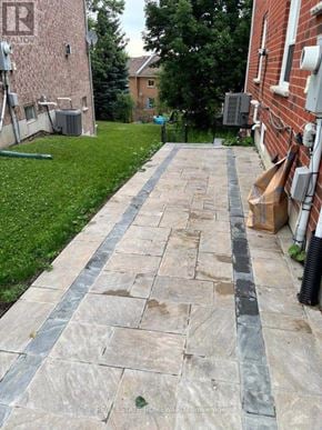 Aurora (Aurora Grove) apartment for rent - A stone pathway leads from the foreground to a grassy area.
