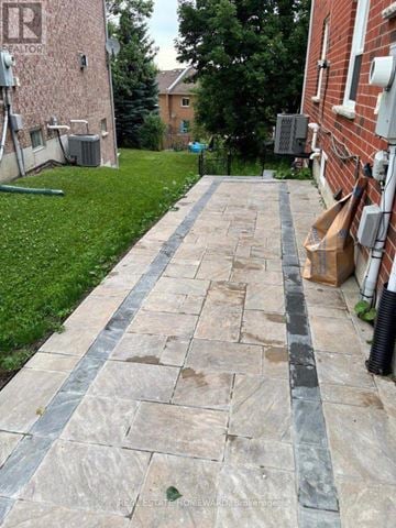 Aurora (Aurora Grove) apartment for rent - A stone pathway leads from the foreground to a grassy area.