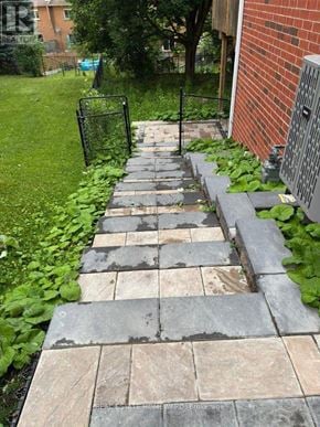 Aurora (Aurora Grove) apartment for rent - A stone pathway leads to a brick building.