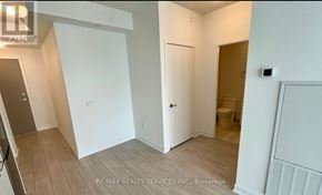 Mississauga (City Centre) condo for rent - A room with a white door and a toilet in the corner.
