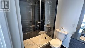 Mississauga (City Centre) condo for rent - A bathroom with a toilet, sink, and shower.