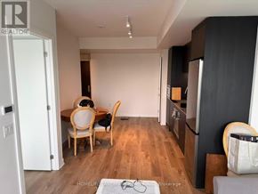 Mississauga (Cooksville) condo for rent - A kitchen with a dining table and chairs is visible.